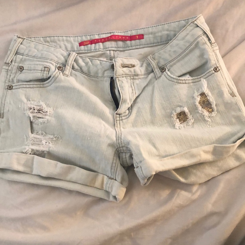 Light blue jean shorts with holes